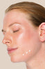 Image of model placing Dr Sam's Flawless Neutralising Gel on their jaw